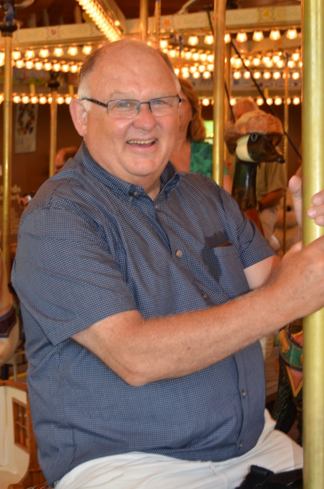 Member Vin McMahon enjoys a ride on the carousel at the Farmers' Museum in Cooperstown, NY.